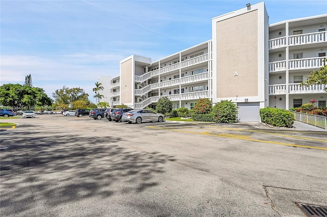 view of property with uncovered parking