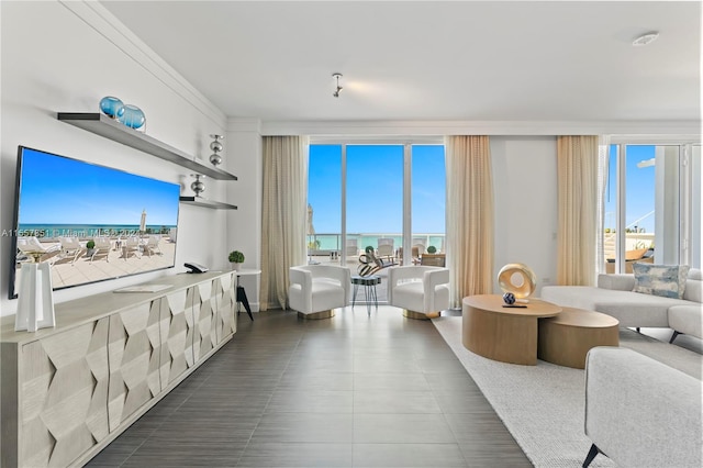 tiled living room with a water view