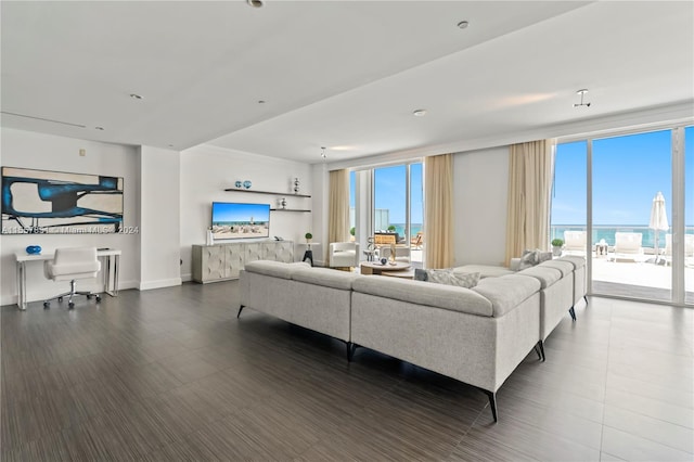 living room featuring a water view and plenty of natural light