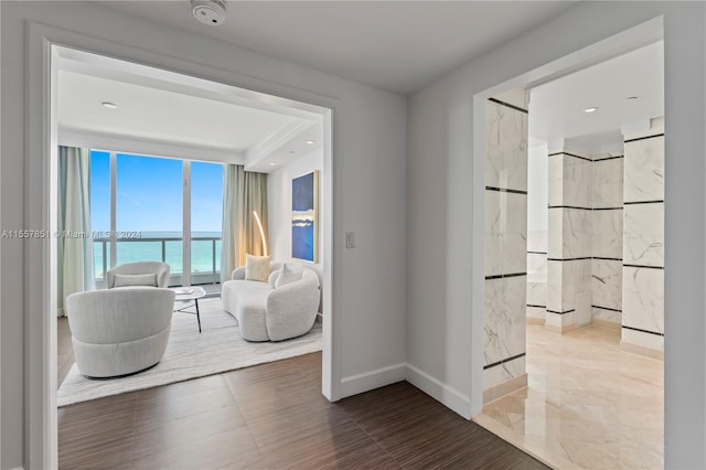 interior space featuring a water view and tile floors