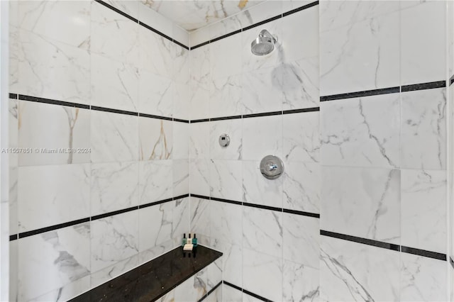 interior space featuring a tile shower