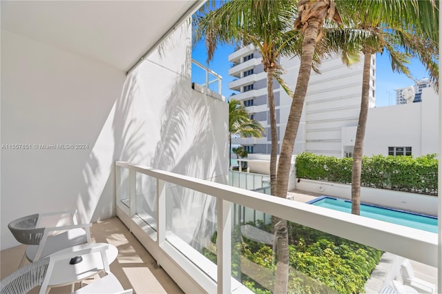 balcony featuring a pool