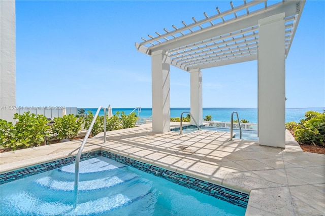 view of pool featuring a water view, a patio area, and a pergola