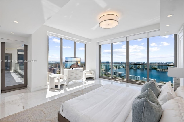 tiled bedroom with a water view, multiple windows, and access to outside