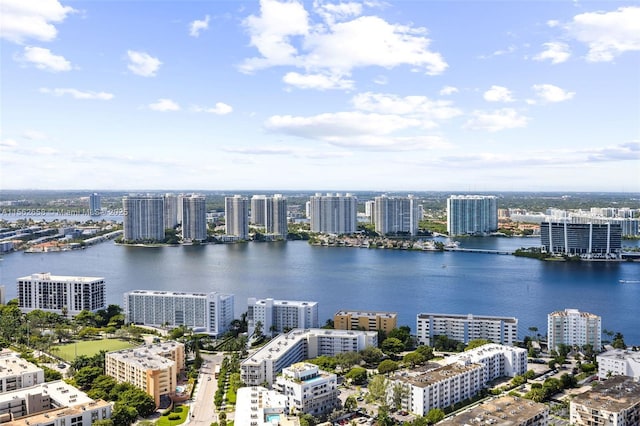 drone / aerial view featuring a water view and a view of city