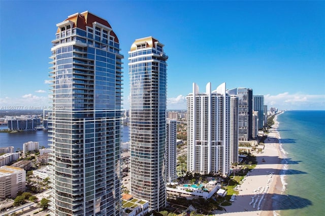 city view featuring a water view and a beach view