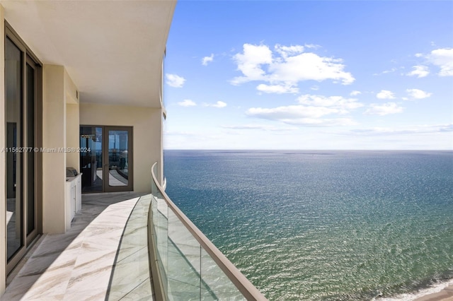 balcony featuring a water view