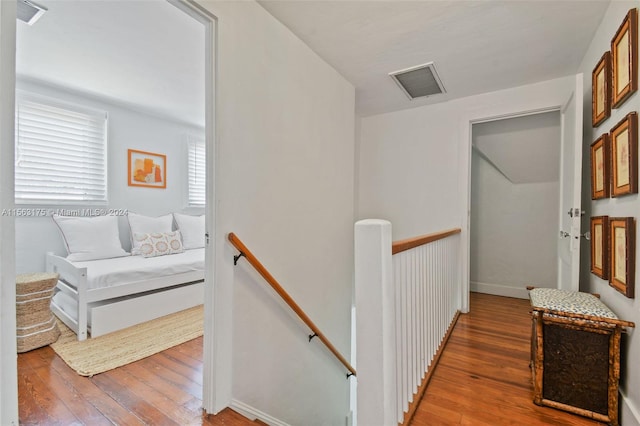 corridor featuring hardwood / wood-style floors