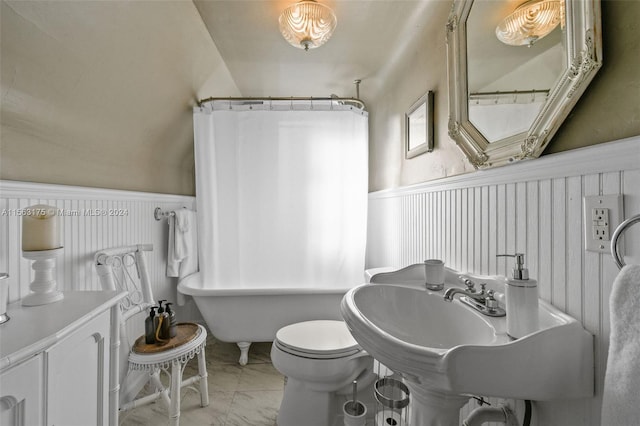 bathroom with toilet and tile floors