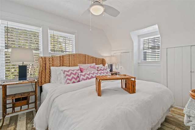 bedroom featuring ceiling fan and dark wood-type flooring