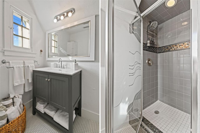 bathroom featuring lofted ceiling, tile floors, tiled shower, and vanity