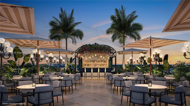 view of patio terrace at dusk