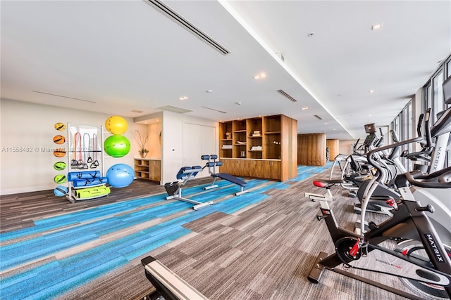 gym with carpet flooring and visible vents