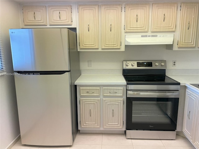 kitchen featuring light tile patterned flooring and stainless steel appliances