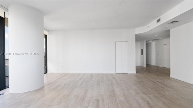 unfurnished room with light hardwood / wood-style flooring