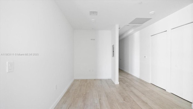 empty room with light wood-type flooring