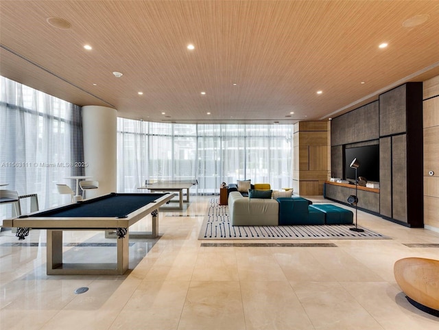 playroom with pool table, wood ceiling, and a wall of windows