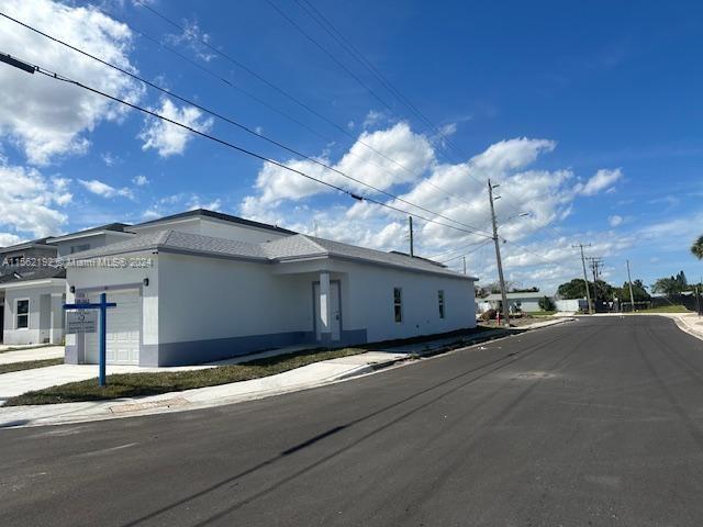 view of side of home with a garage