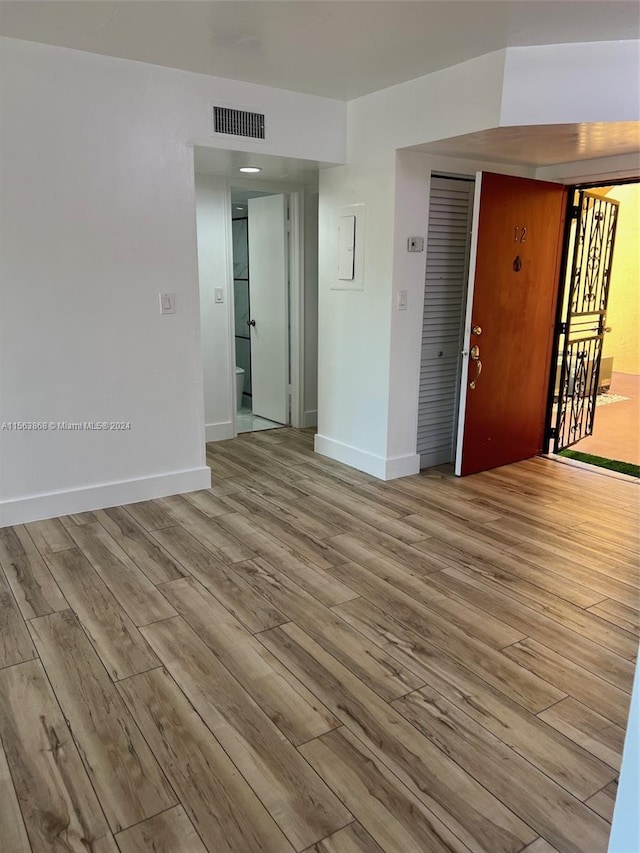 spare room featuring light hardwood / wood-style flooring