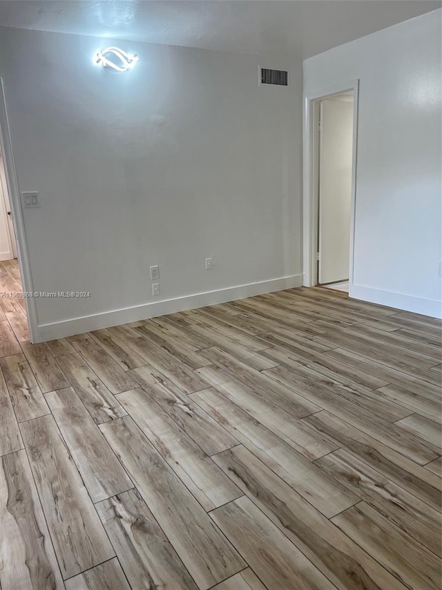 unfurnished room featuring light hardwood / wood-style flooring