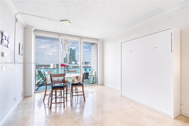 dining space with floor to ceiling windows, ornamental molding, light tile floors, and a textured ceiling