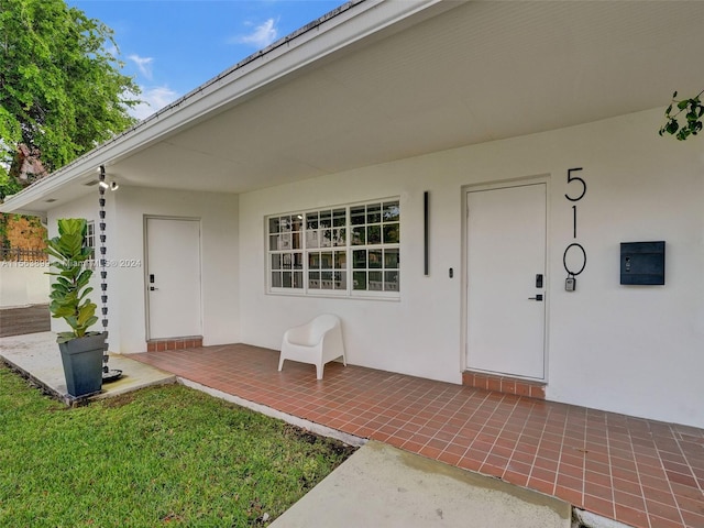 doorway to property with a patio area