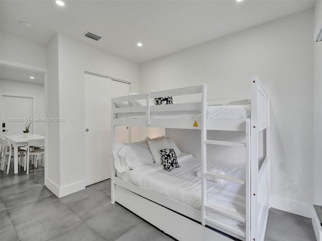 bedroom with light tile floors