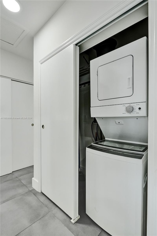 laundry room featuring stacked washer and clothes dryer