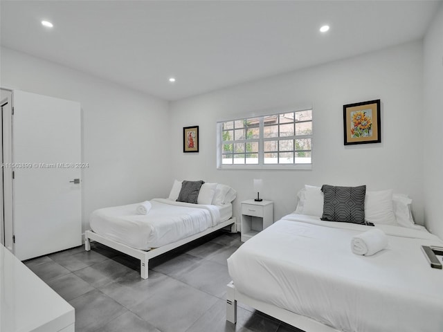 bedroom featuring light tile floors