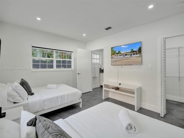 bedroom featuring a closet and a walk in closet