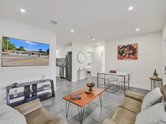 tiled living room featuring sink