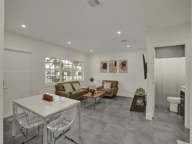 living room featuring light tile floors