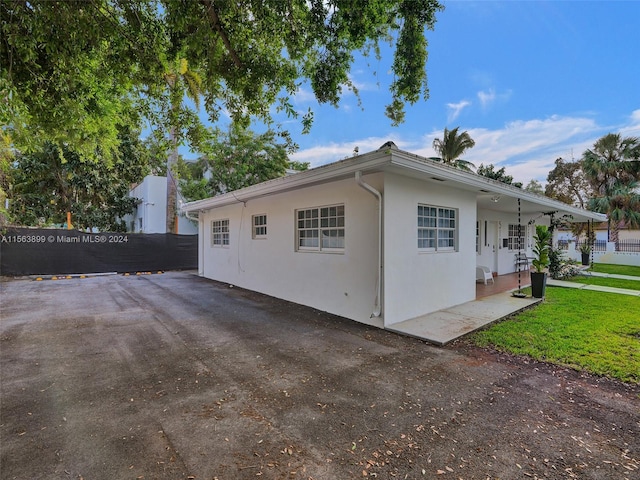 view of home's exterior featuring a yard