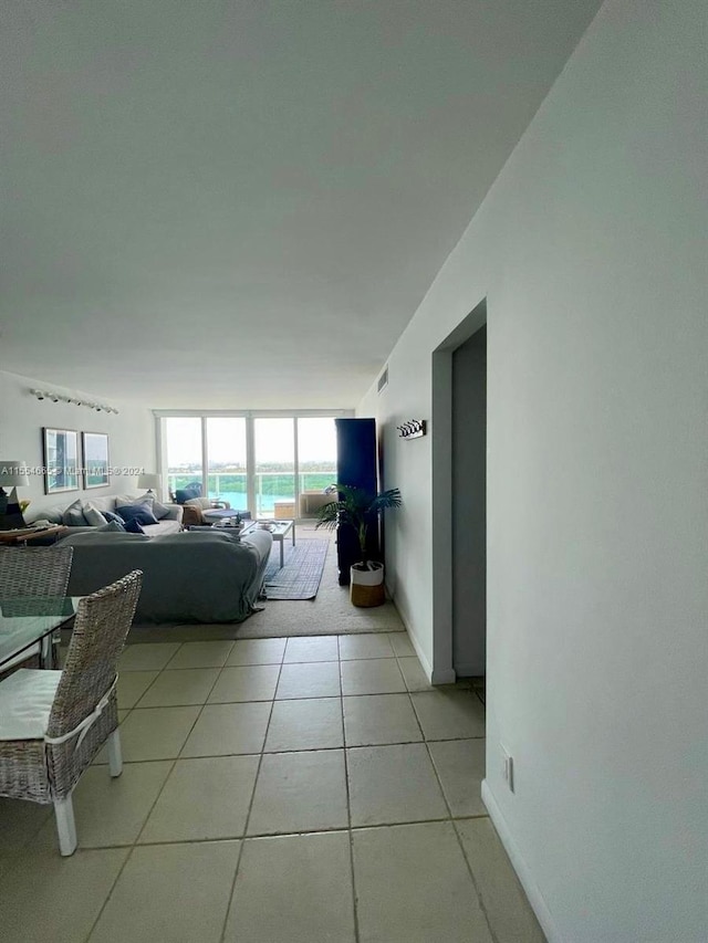 living room featuring light tile floors