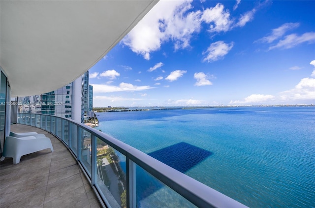 balcony featuring a water view