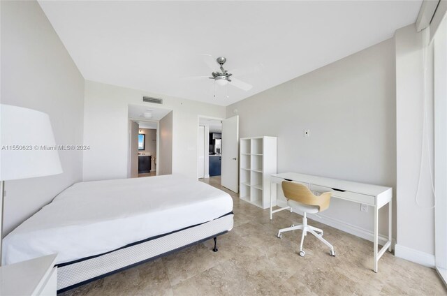 tiled bedroom with ceiling fan