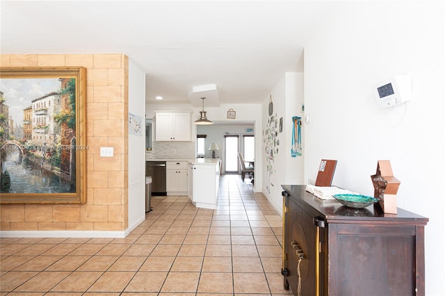 hall with light tile flooring