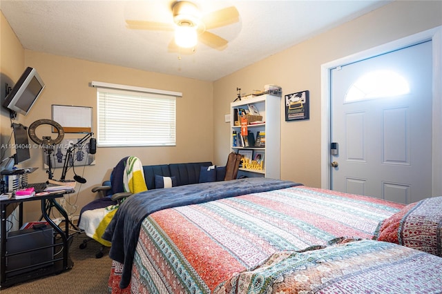 carpeted bedroom with ceiling fan