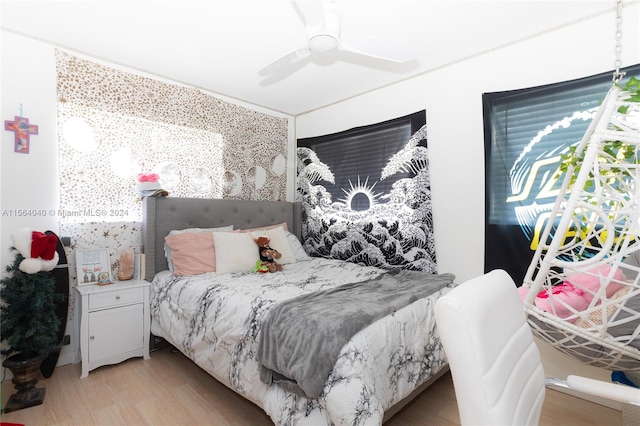 bedroom featuring light hardwood / wood-style floors and ceiling fan