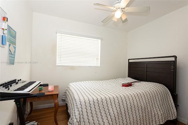 bedroom featuring ceiling fan and dark hardwood / wood-style floors