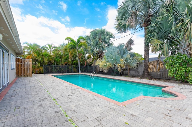 view of pool featuring a patio area