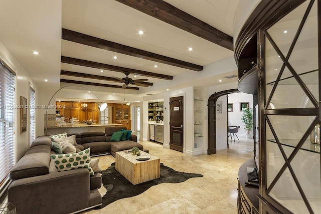 living room with ceiling fan, beam ceiling, and light tile flooring