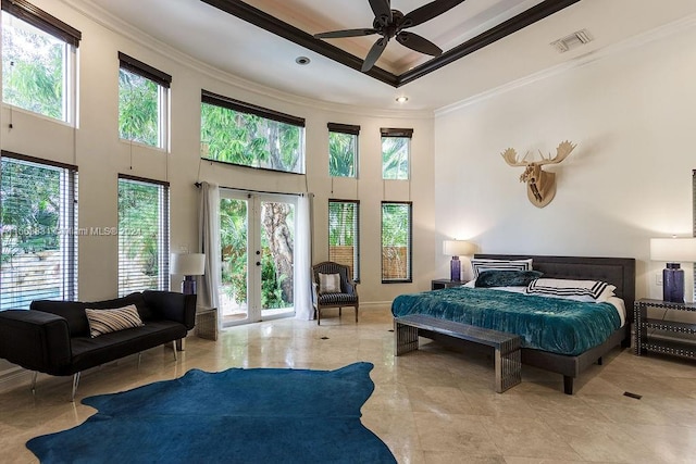 tiled bedroom with access to exterior, ornamental molding, ceiling fan, and a towering ceiling