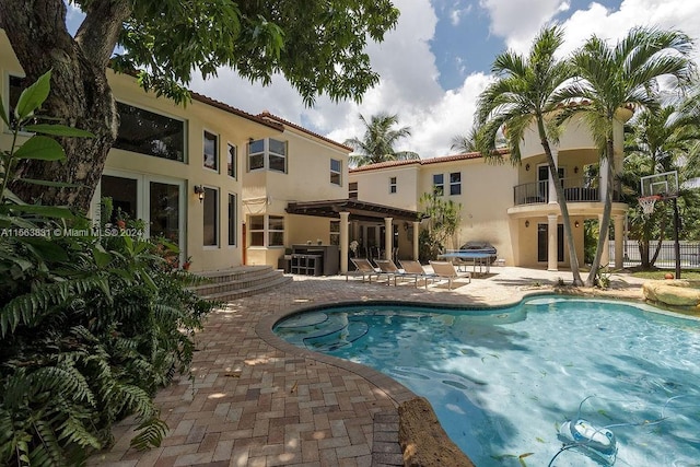 view of pool with central AC unit and a patio area