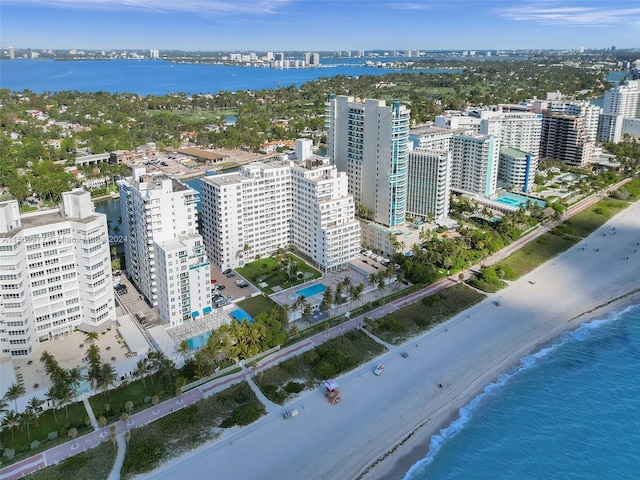 bird's eye view featuring a beach view and a water view