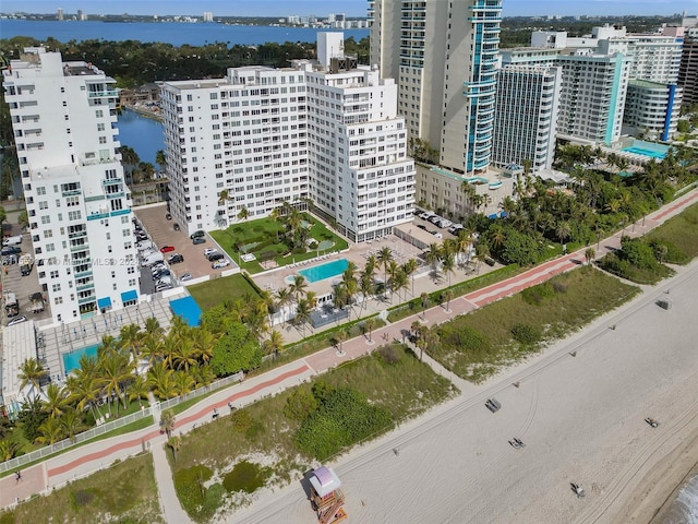 birds eye view of property with a water view