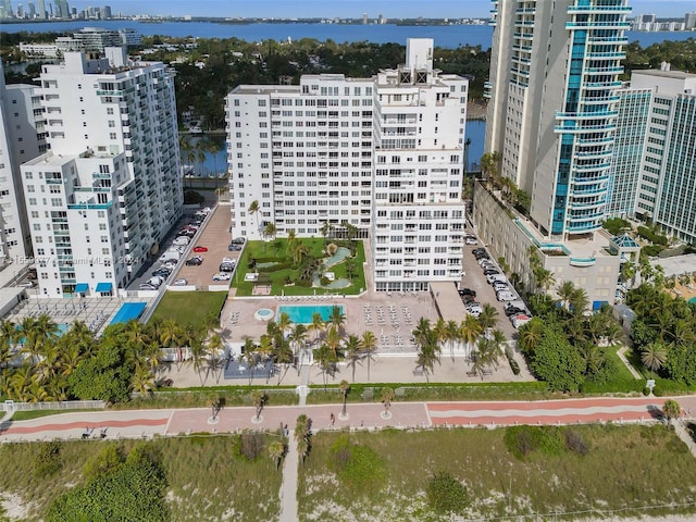 birds eye view of property with a water view