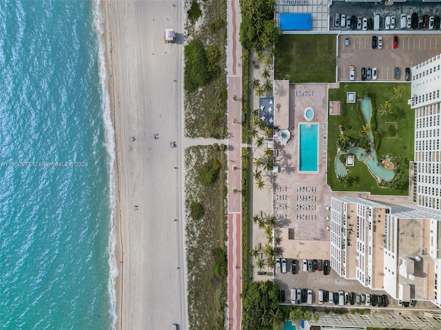 bird's eye view featuring a beach view and a water view