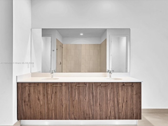 bathroom with tile patterned floors and vanity