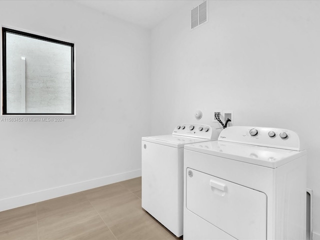 laundry area featuring separate washer and dryer